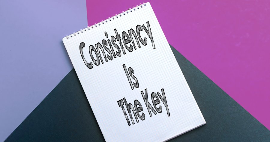 Three block colours form the background and then on top of this is a notepad with the words "Consistency is key"