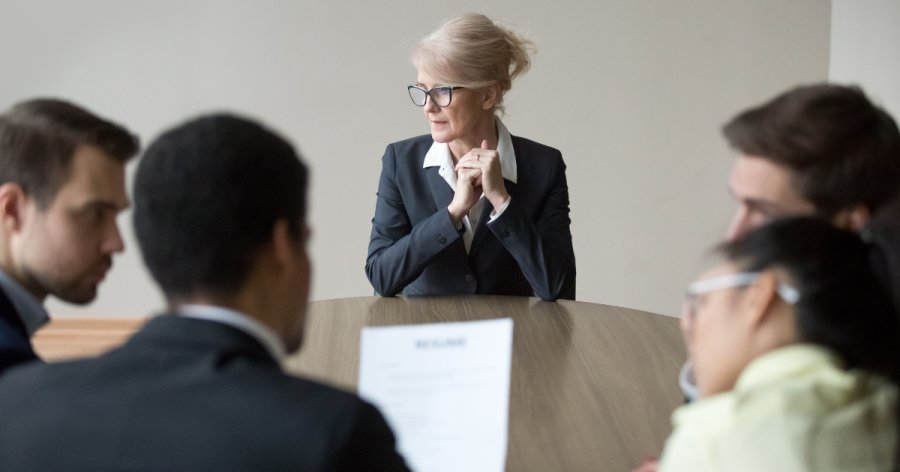 AI tender writing - the image shows a boardroom interview scene depticting a tender interview