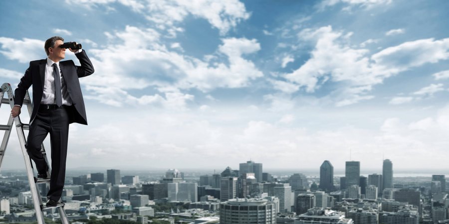 Man standing looking over a city scape, representing looking for reasons why you won a render